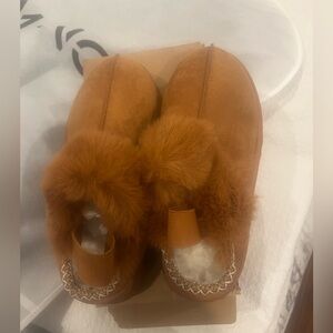 Brand new in box suede slipper. cozy, warm and co